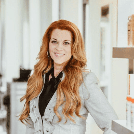 Portrait of Roberta, a professional stylist at Ottalaus Salon, showcasing their expertise and style.