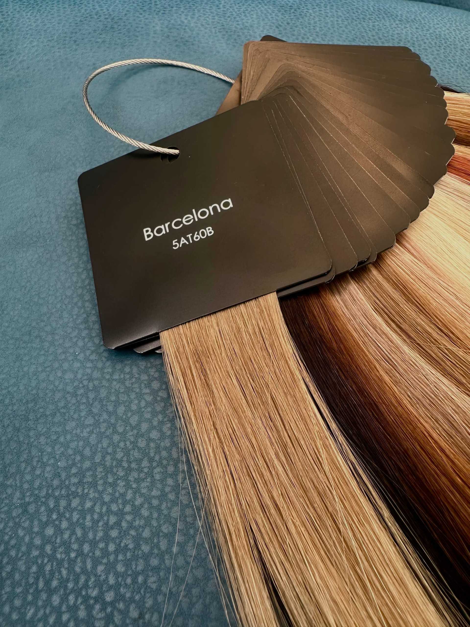 Hair color swatches labeled 'Barcelona' on a textured blue surface.
