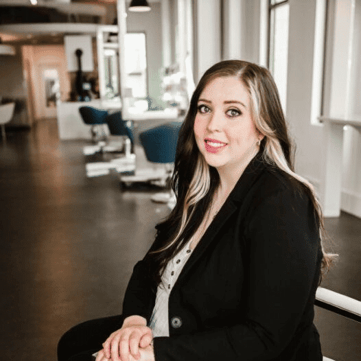Portrait of Sara, a professional stylist at Ottalaus Salon, showcasing their expertise and style.