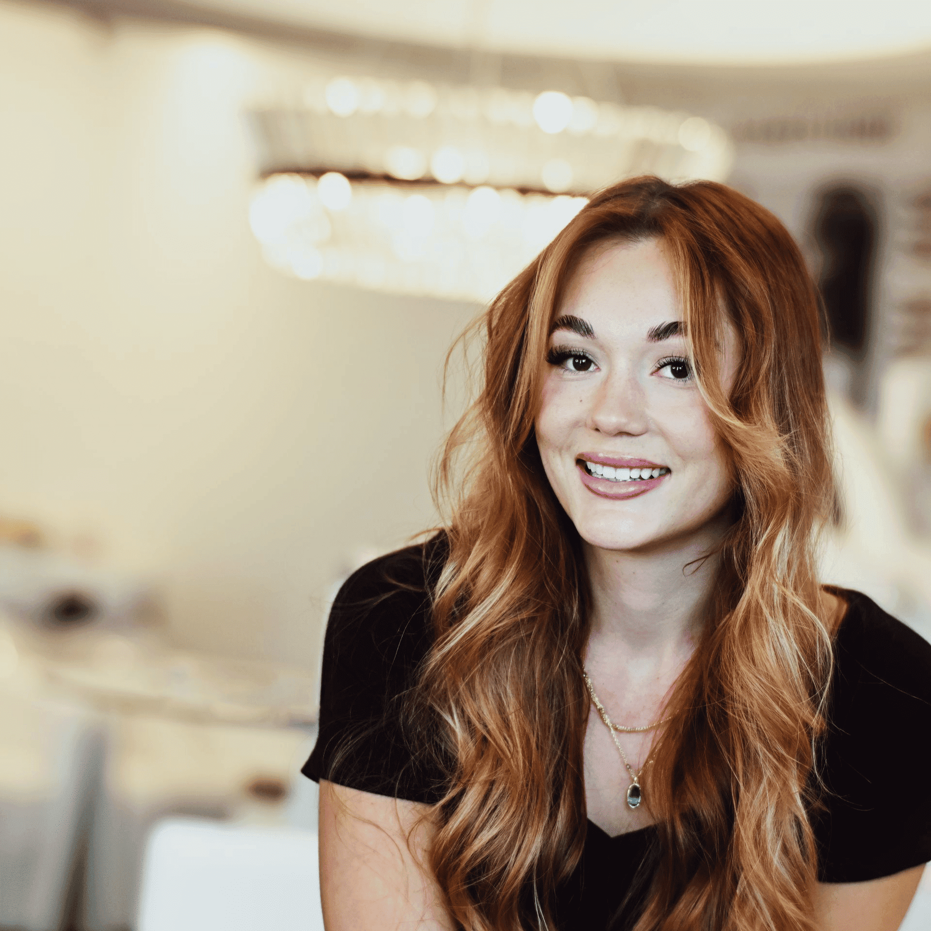 Portrait of Sam, a professional stylist at Ottalaus Salon, showcasing their expertise and style.