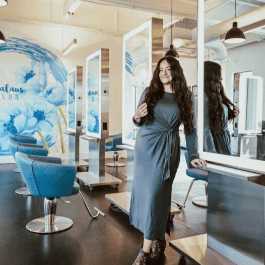 Portrait of Shawni, a professional stylist at Ottalaus Salon, showcasing their expertise and style.