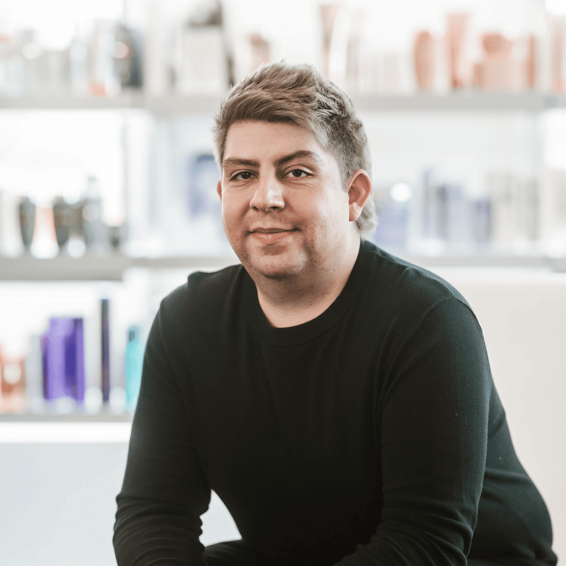 Portrait of Joseph, a professional stylist at Ottalaus Salon, showcasing their expertise and style.
