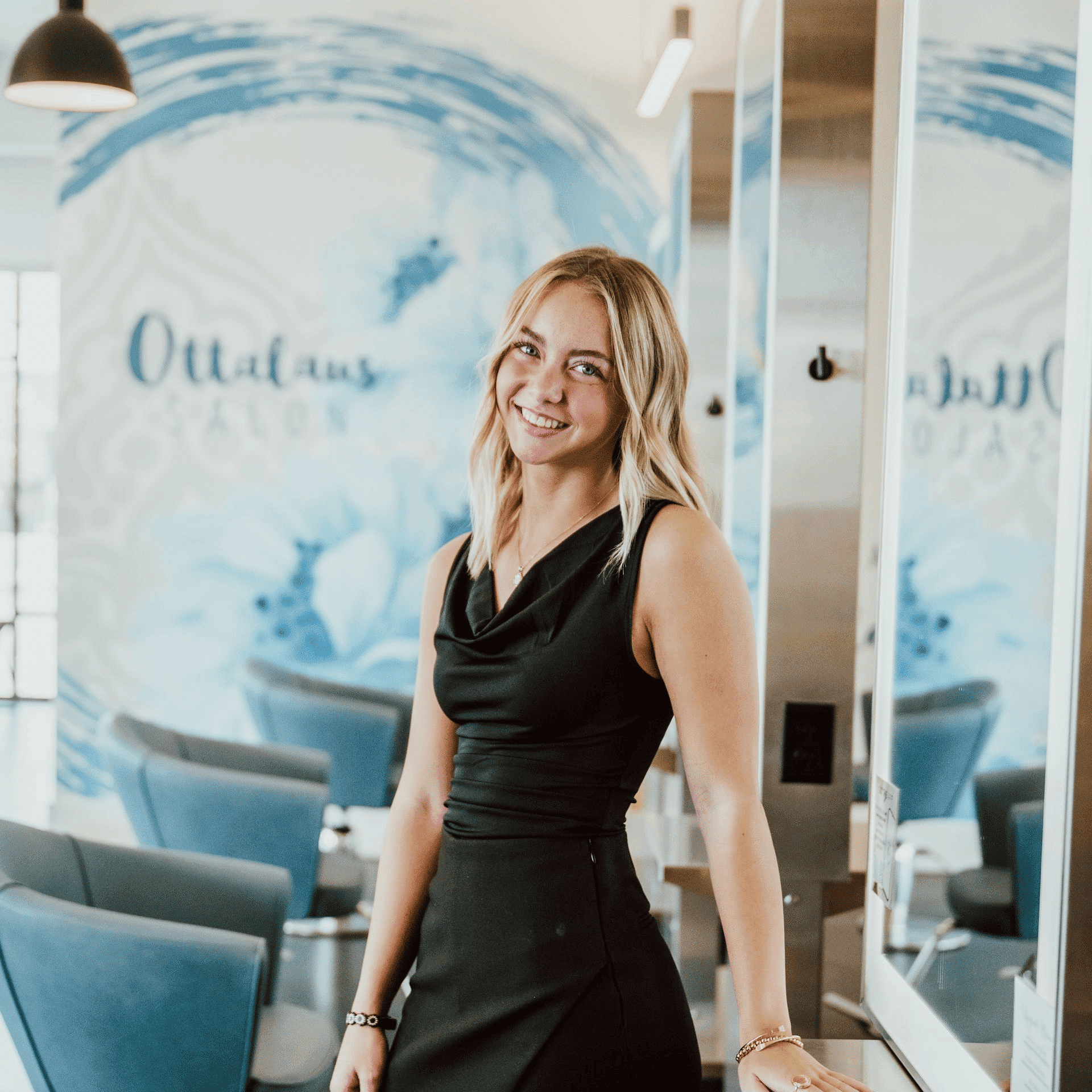 Portrait of Hannah, a professional stylist at Ottalaus Salon, showcasing their expertise and style.