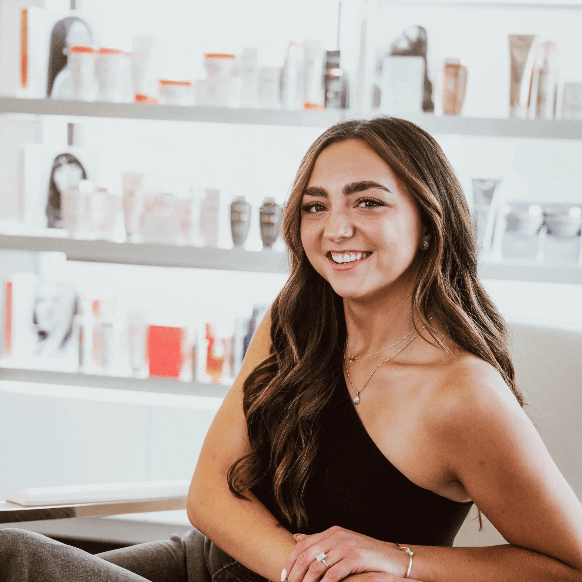 Portrait of Allie, a professional stylist at Ottalaus Salon, showcasing their expertise and style.