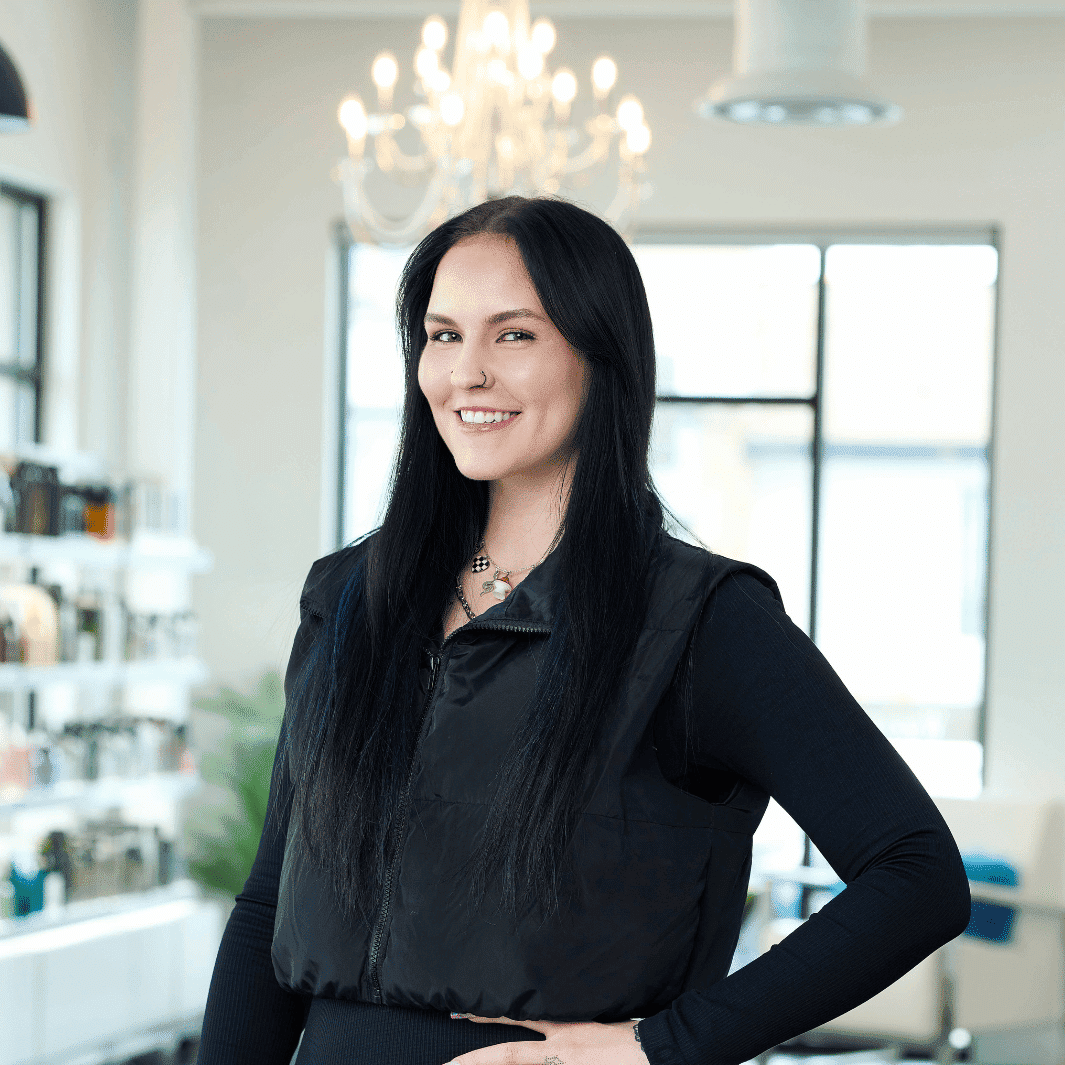Portrait of Lauren, a professional stylist at Ottalaus Salon, showcasing their expertise and style.