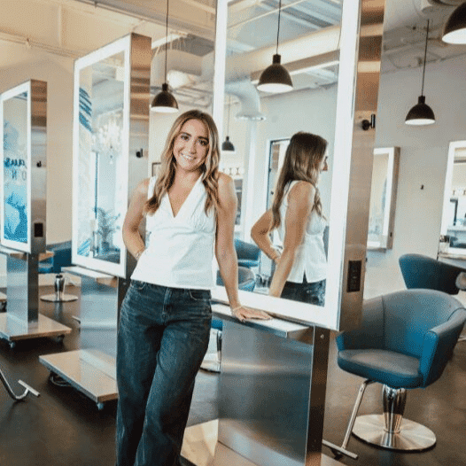 Portrait of Macall, a professional stylist at Ottalaus Salon, showcasing their expertise and style.