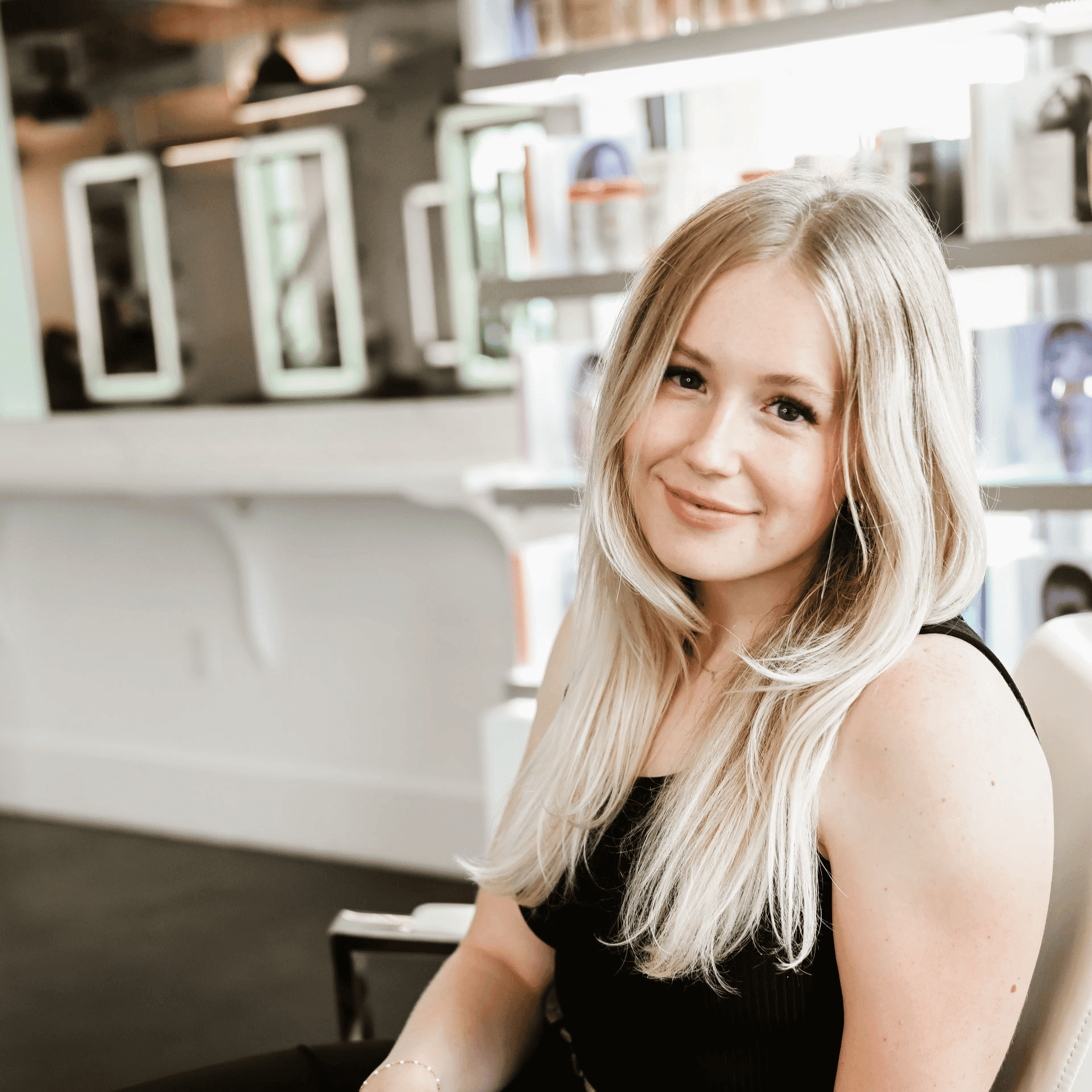 Portrait of Brooklynne, a professional stylist at Ottalaus Salon, showcasing their expertise and style.