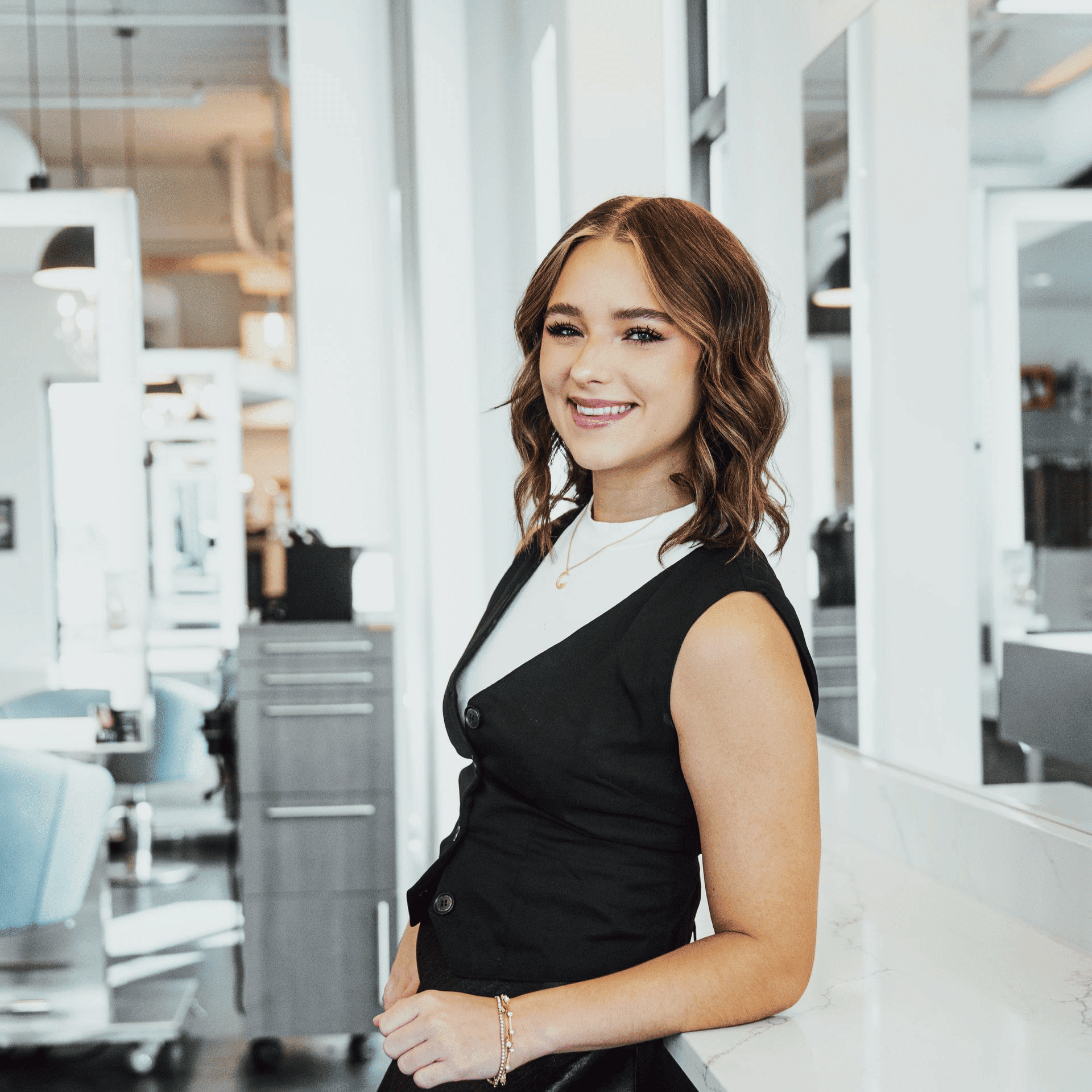Portrait of Beklynn Bennett, a professional stylist at Ottalaus Salon, showcasing their expertise and style.