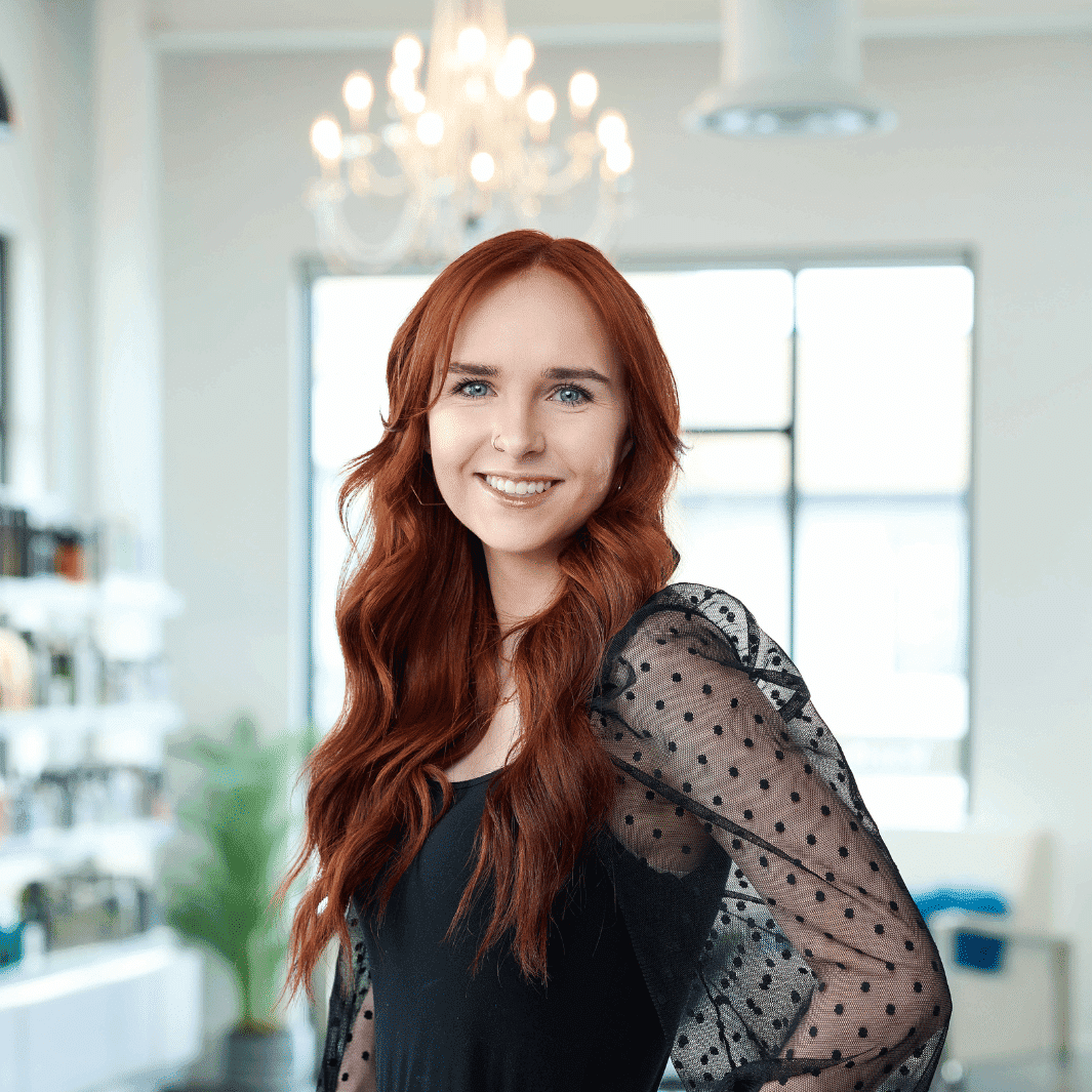 Portrait of Ariana, a professional stylist at Ottalaus Salon, showcasing their expertise and style.