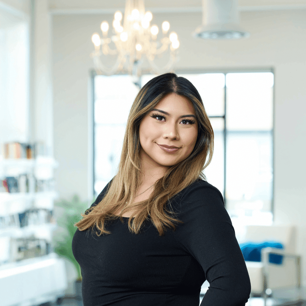 Portrait of Sofia, a professional stylist at Ottalaus Salon, showcasing their expertise and style.