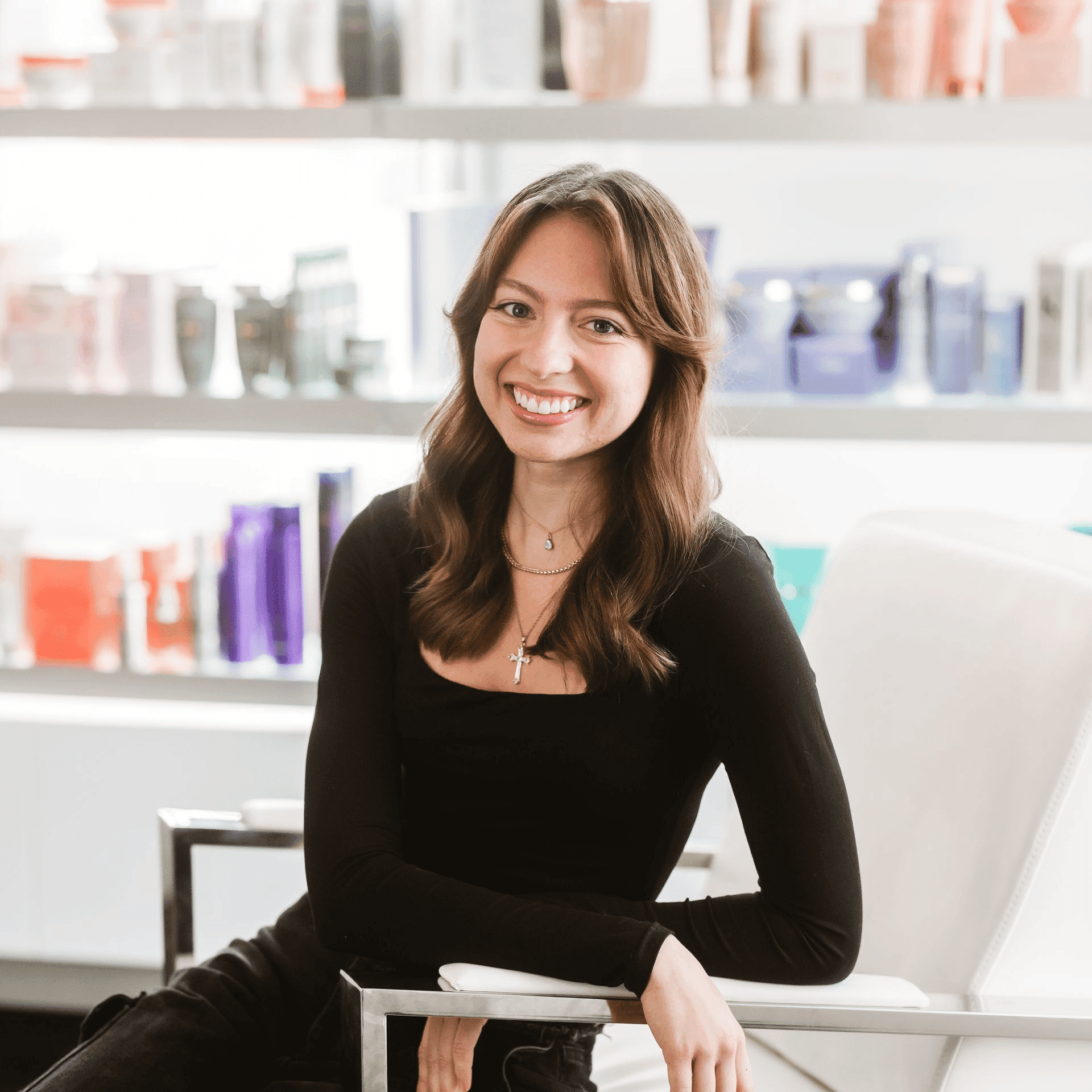 Portrait of Hailee, a professional stylist at Ottalaus Salon, showcasing their expertise and style.