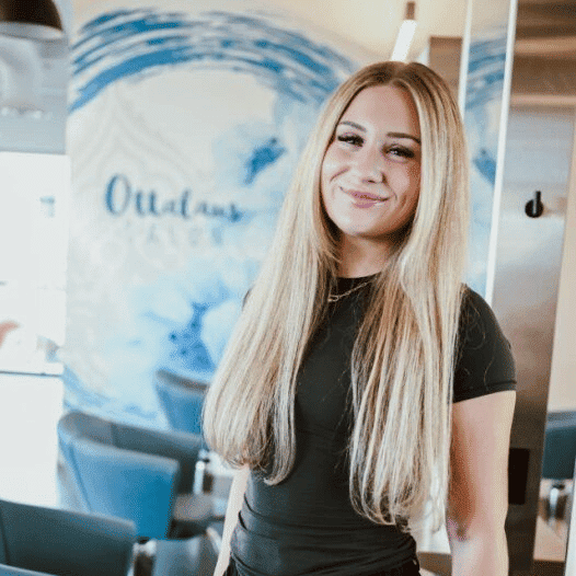 Portrait of Julia, a professional stylist at Ottalaus Salon, showcasing their expertise and style.