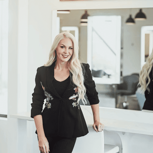 Portrait of AnneMarie Krainich, a professional stylist at Ottalaus Salon, showcasing their expertise and style.