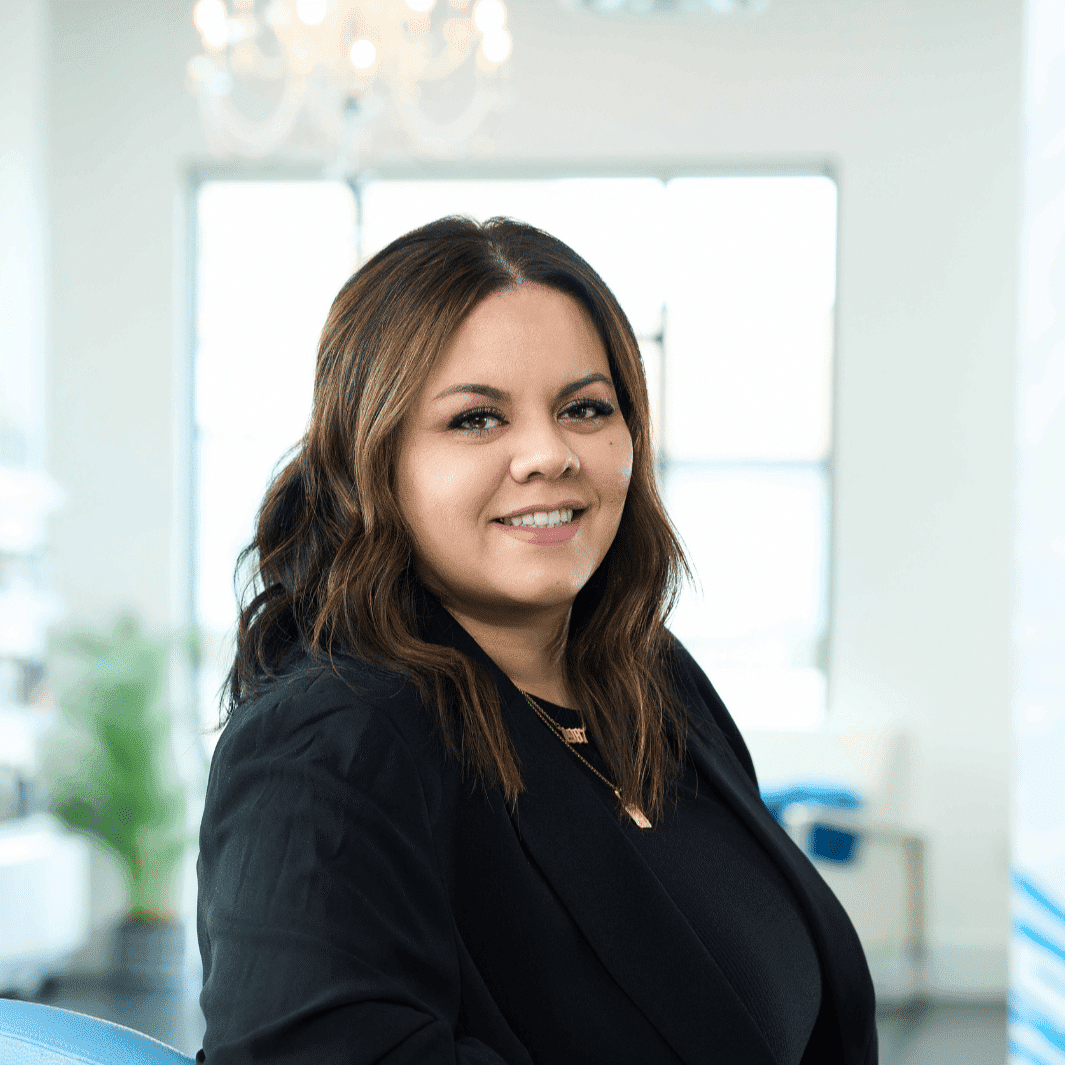 Portrait of Esther, a professional stylist at Ottalaus Salon, showcasing their expertise and style.