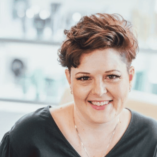Portrait of Randilee, a professional stylist at Ottalaus Salon, showcasing their expertise and style.